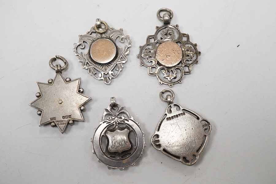 Five assorted early 20th century silver medals, including enamelled 'Luton District Football League, 1910/11', diameter 28mm.